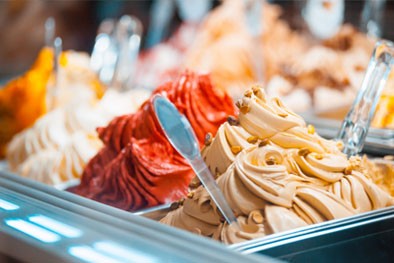 Photo: Smooth gelato with flavors including strawberry, pistachio, and other fruits